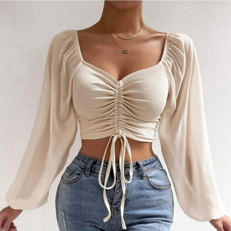 Vrouwelijke croptop met lange mouwen